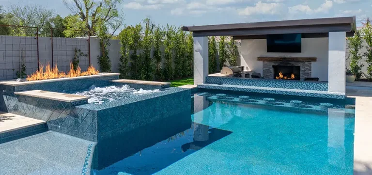 Backyard pool with fireplace